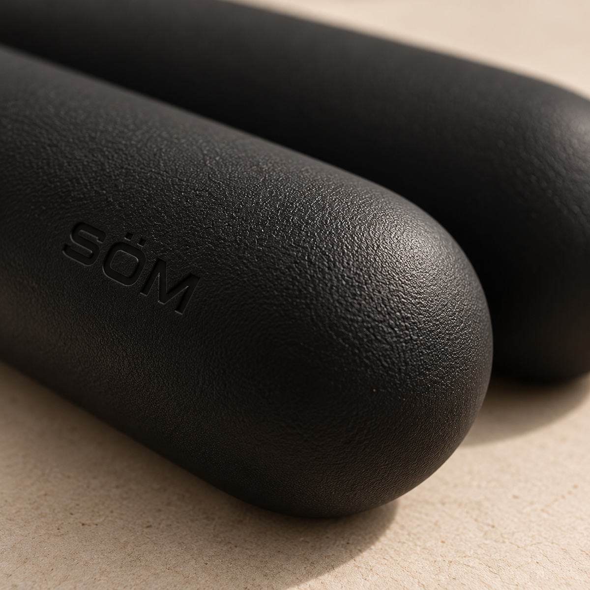 Close-up of the textured silicone finish on black SÖM Balance Weights