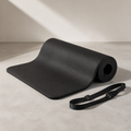 Black SÖM Ground Mat partially rolled with carry strap