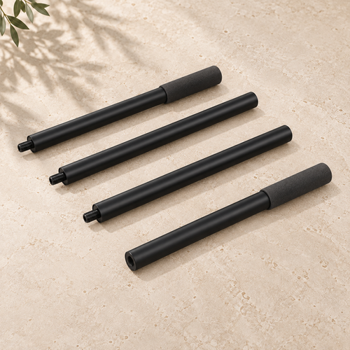 Four black SÖM Mobility Stick sections with threaded connectors and two foam grips, arranged on a pale stone surface.